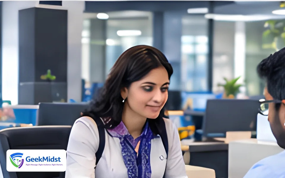 Advisor meeting a client at a desk in a modern office